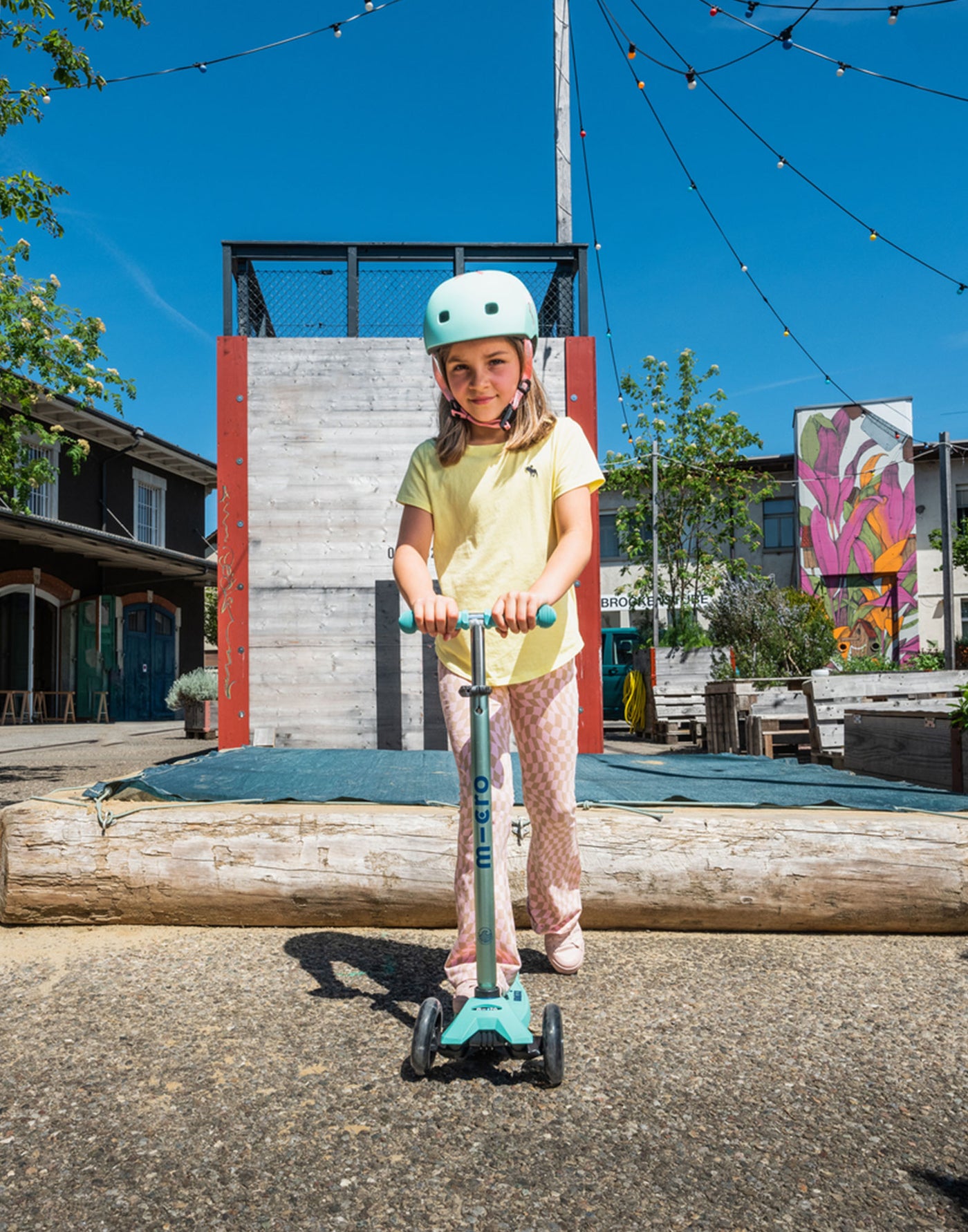 girl riding mint maxi micro deluxe eco led scooter