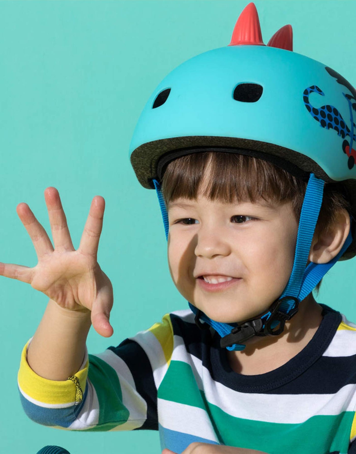 boy wearing awesome scootersauras light up helmet