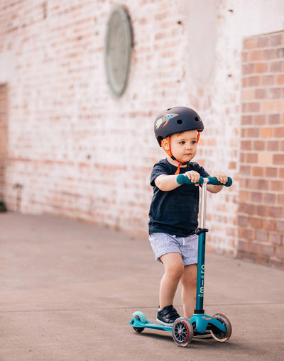 little boy on his aqua mini micro deluxe scooter
