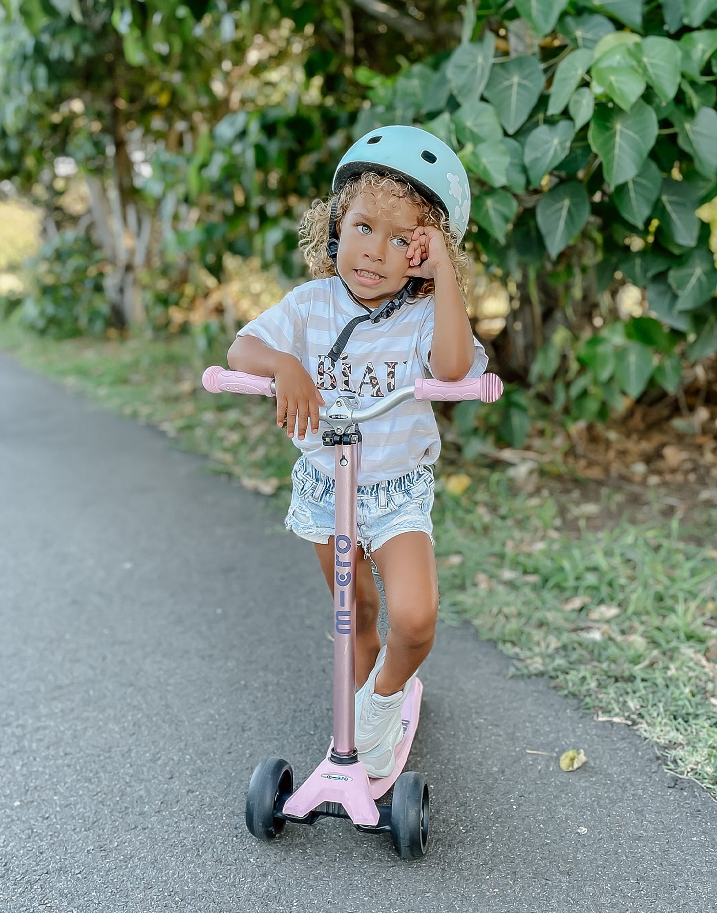 kid on their maxi deluxe pro rose pink scooter
