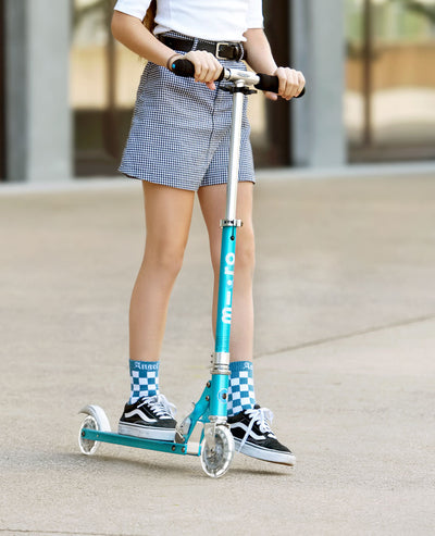 teen riding ocean blue sprite kids scooter with led wheels