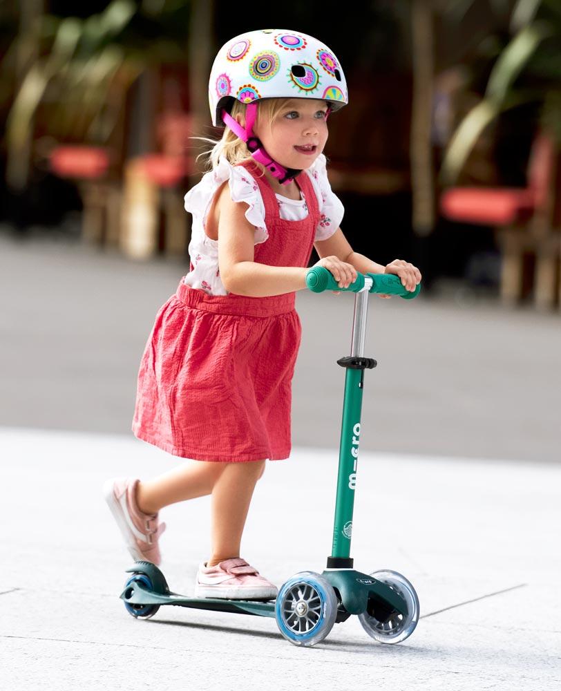 preschooler on her mini deluxe eco deep green scooter
