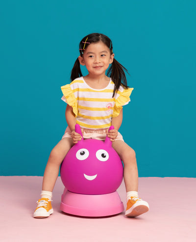 toddler on their pink inflatable air hopper
