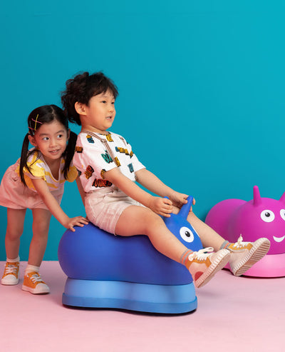 toddlers playing on their inflatable ride on air hoppers